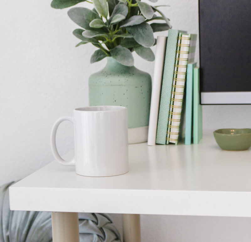 Desk with coffee cup and books